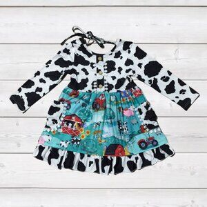 Cowprint Tie Ruffle Dress with Farm Setting on Lower Half 18 - 24 Months